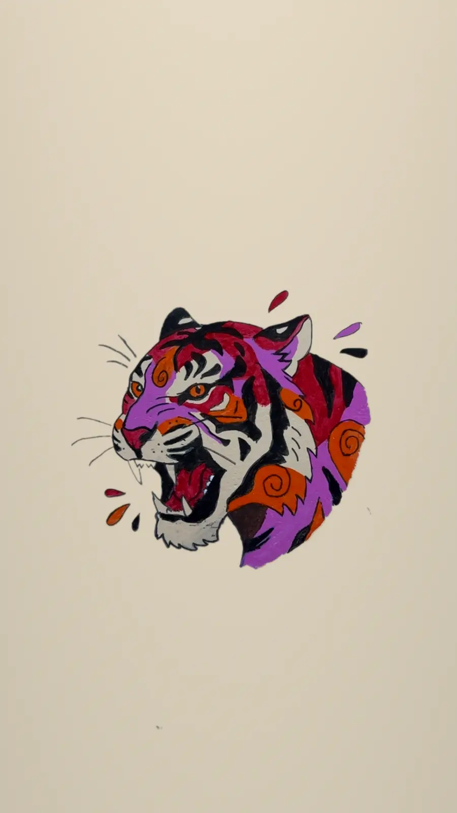 The finished tiger painted on a cream wall in red, purple and orange